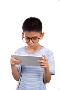 Young woman using smart phone against white background