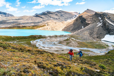 Backpackers trekking into the alpine above michelle lakes