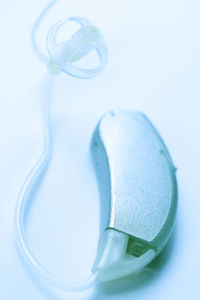 Close-up of hearing aid over white background