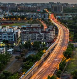 High angle view of light trails on road in city