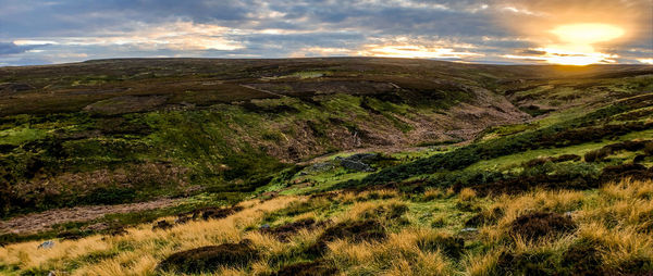 Scenic view of landscape against sky during sunset