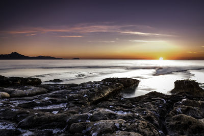 Scenic view of sea against sky during sunset