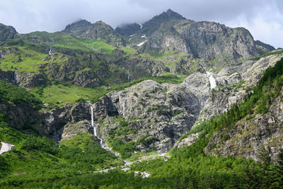 Scenic view of mountains against sky,a lot of waterfalls.
