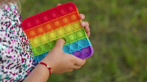 Cropped hand of woman holding pills