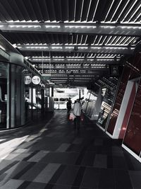 Rear view of man walking in building