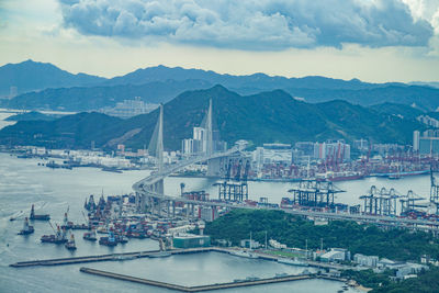 High angle view of river and cityscape against sky