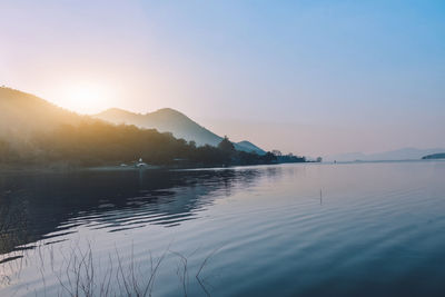 Scenic view of lake against sky during sunset