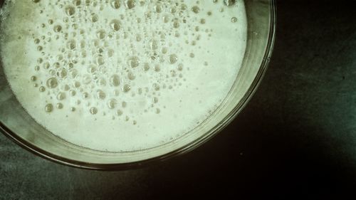 High angle view of coffee in glass on table