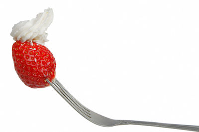 Close-up of strawberry against white background