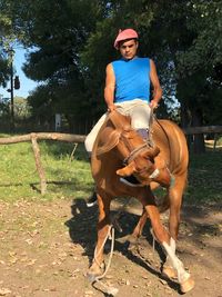 Portrait of woman riding horse