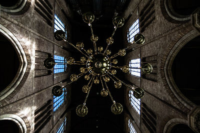 Low angle view of chandelier hanging from ceiling