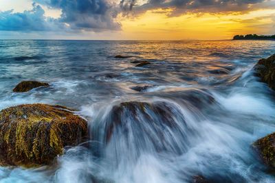 Scenic view of sea against sky during sunset