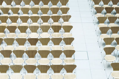 High angle view of empty chairs arranged indoors