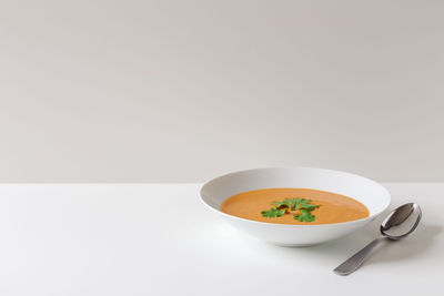 Close-up of soup in bowl on white background