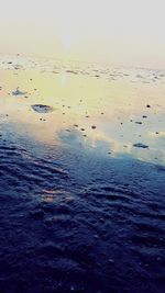 Scenic view of sea against sky at sunset