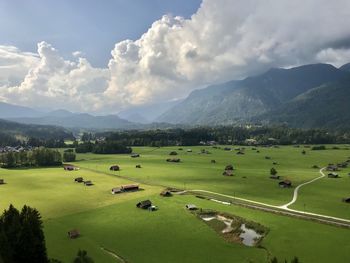 Scenic view of landscape against cloudy sky