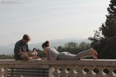 People relaxing on mountain