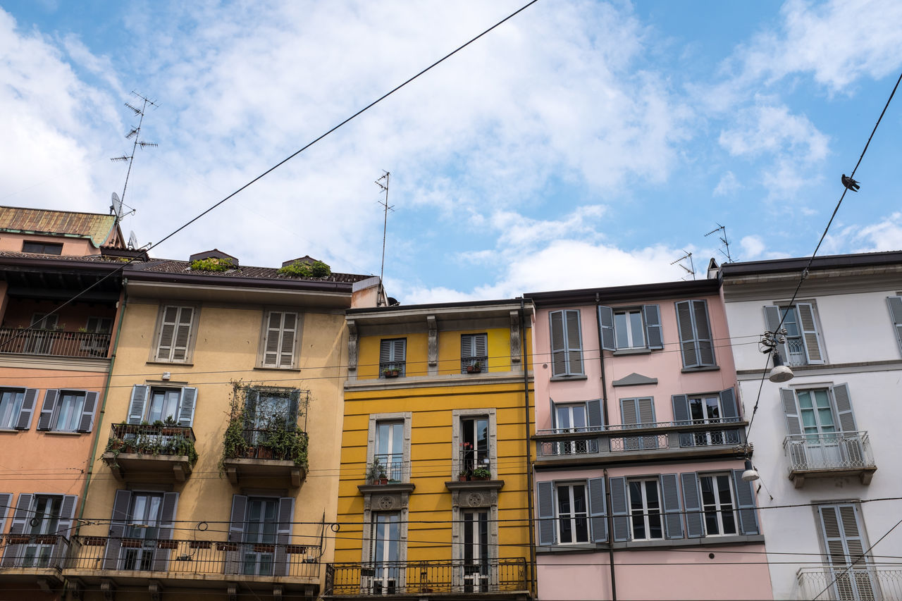 LOW ANGLE VIEW OF RESIDENTIAL BUILDINGS AGAINST SKY