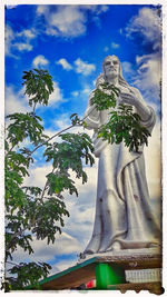 Low angle view of statue against sky