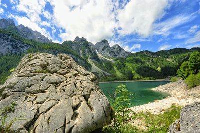 Scenic view of lake and mountains against sky