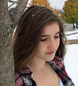 Young woman looking up