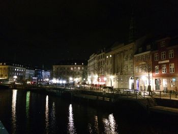 Reflection of illuminated buildings in water