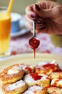 Dripping jam on a pancake 