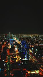 High angle view of illuminated buildings in city at night