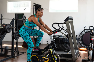 Portrait of woman exercising in gym