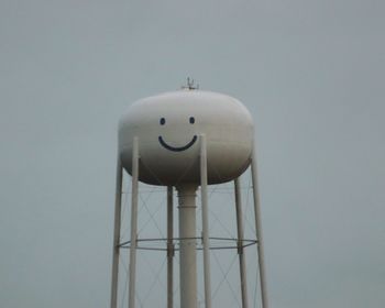 Low angle view of water tower against sky