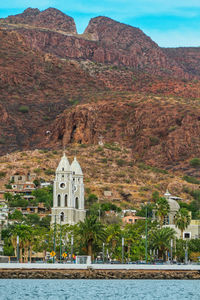 Building with mountain range in the background