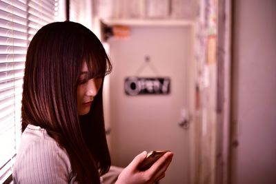 Young woman using mobile phone