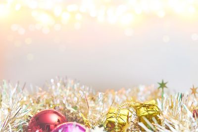 Close-up of christmas decorations against bright sun