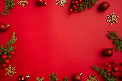 Directly above shot of christmas decorations on yellow background
