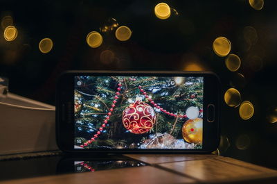 Close-up of illuminated christmas lights at night