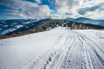 Scenic view of snowcapped mountains against sky