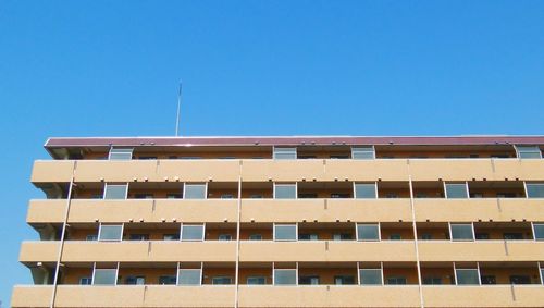 Low angle view of building against blue sky