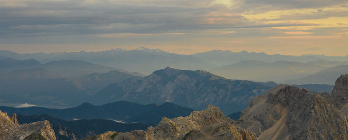 Scenic view of mountains against sky during sunset