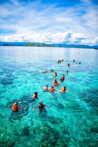 This snorkeling spot located in kanawa island, indonesia. the water is crystal clear. 