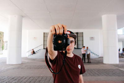 Portrait of boy photographing