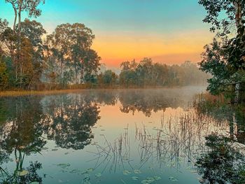 Scenic view of lake against sky during sunset