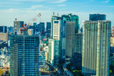 Modern buildings in city against sky