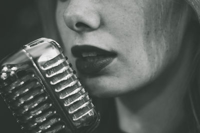 Close-up of young woman singing