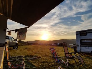 Scenic view of field against sky during sunset