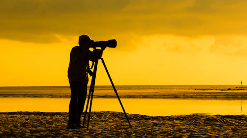 Photographer taking shot by riverside