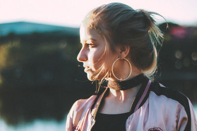 Close-up of young woman looking away