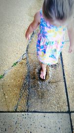 Girl standing on footpath