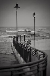 Pier over sea against sky