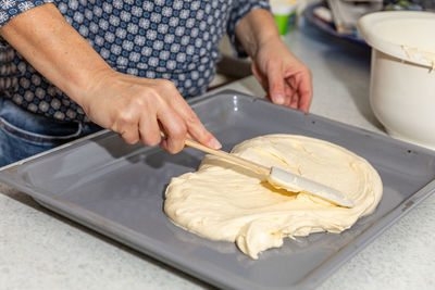 Midsection of man preparing food