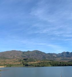 Scenic view of lake against blue sky